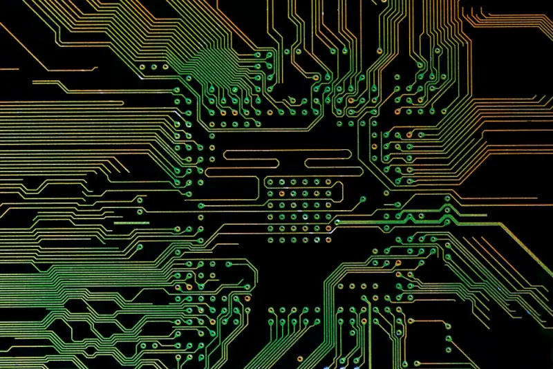 High-density PCB routing with via arrays around a BGA footprint—signal-integrity focus in modern PCB assembly design.